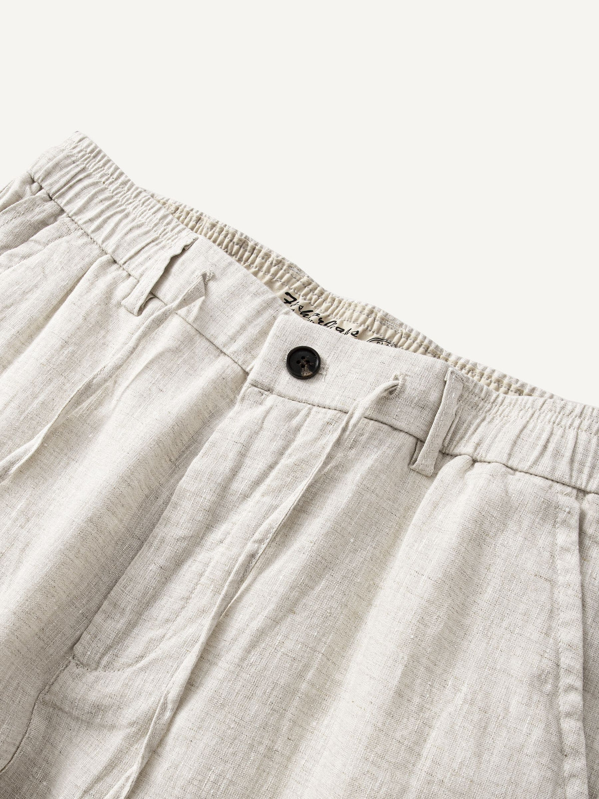 Front waistband detail of OROMEN Crosshatch Weave Relaxed Trousers with drawcord