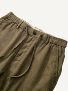 Front waistband detail of OROMEN Herringbone Weave Linen Trousers with drawcord