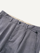 Front waistband detail of OROMEN Pleated Relaxed Fit Linen Trousers with double pleats