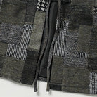 Hem detail of OROMEN KIMONO021 Patchwork Houndstooth Kimono Jacket, clean finished hem edge, grey patchwork panel construction