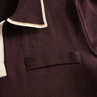 Left chest welt pocket close-up on OROMEN chocolate brown viscose
knit polo, refined pocket detail on smooth knit body
