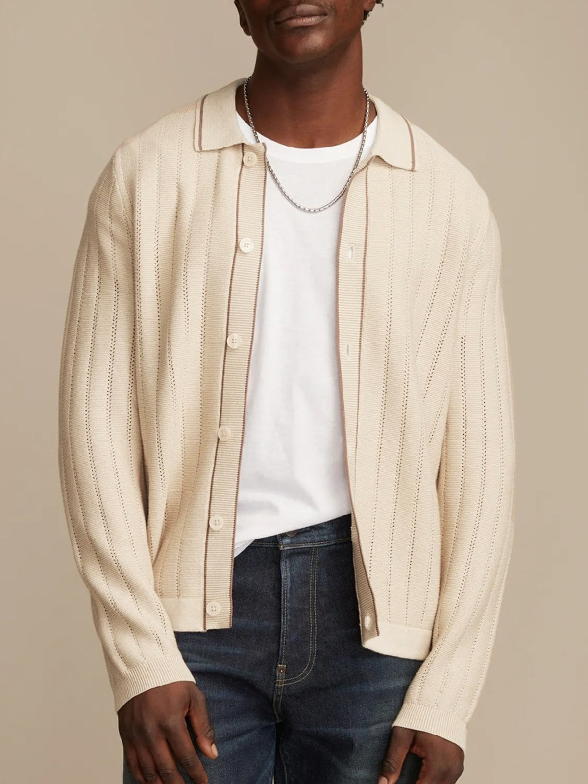 Lifestyle model wearing OROMEN Contrast Tipped Knit Sweater