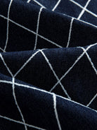 Macro texture close-up of 86% cotton blend fabric and white diamond lattice print