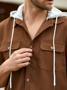Model showcasing collar and hood of OROMEN Rust Hooded Utility Shirt