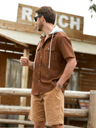 Model standing wearing OROMEN Rust Hooded Utility Shirt