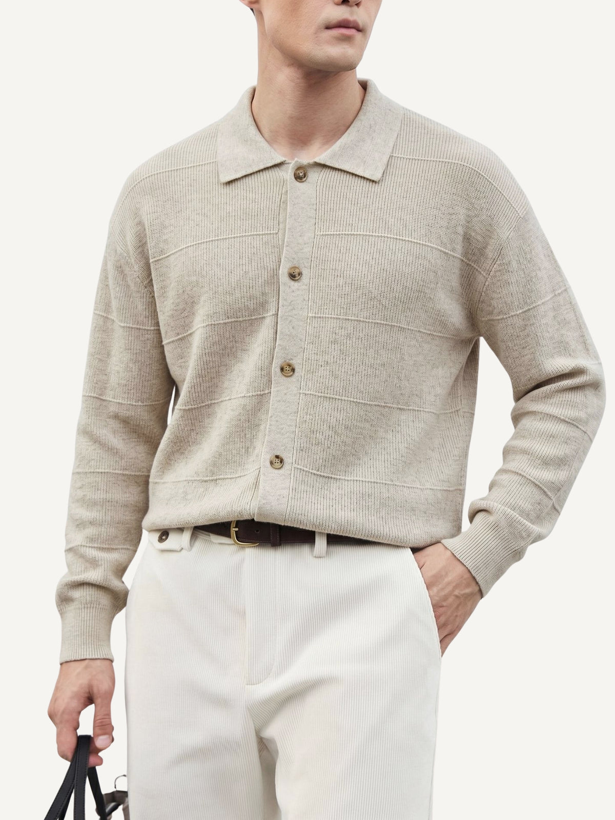 Model wearing OROMEN Horizontal Textured Ribbed Polo Cardigan in oatmeal paired with trousers