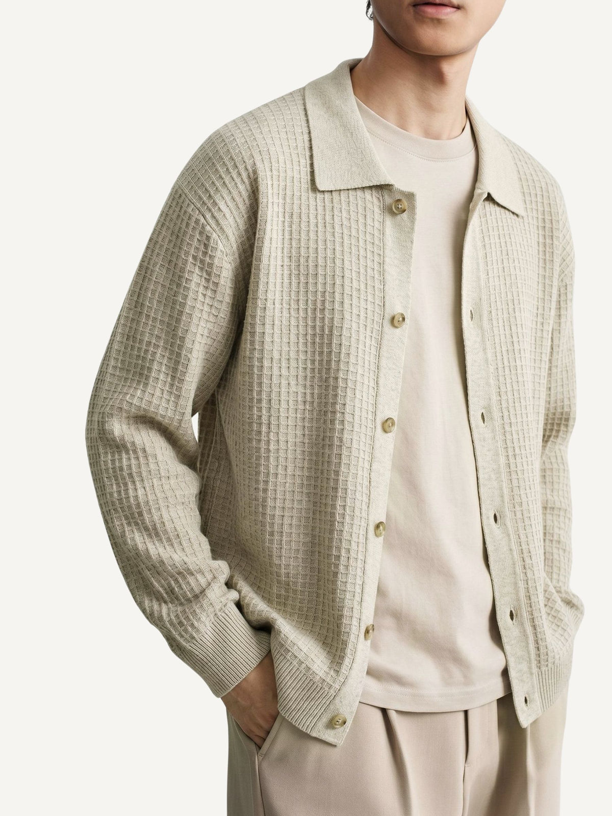 Model wearing OROMEN beige Ribbed Button-Down Sweater Cardigan in casual fit