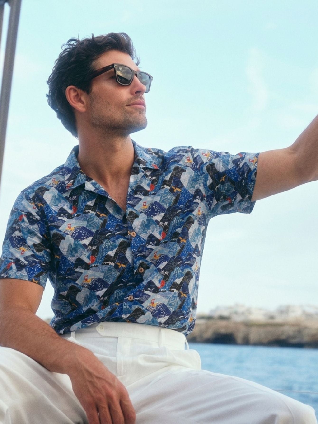 Model wearing the OROMEN Wavy Mountain Landscape Shirt — pure cotton texture, featuring patterns of cranes, koi, and fishing boats.