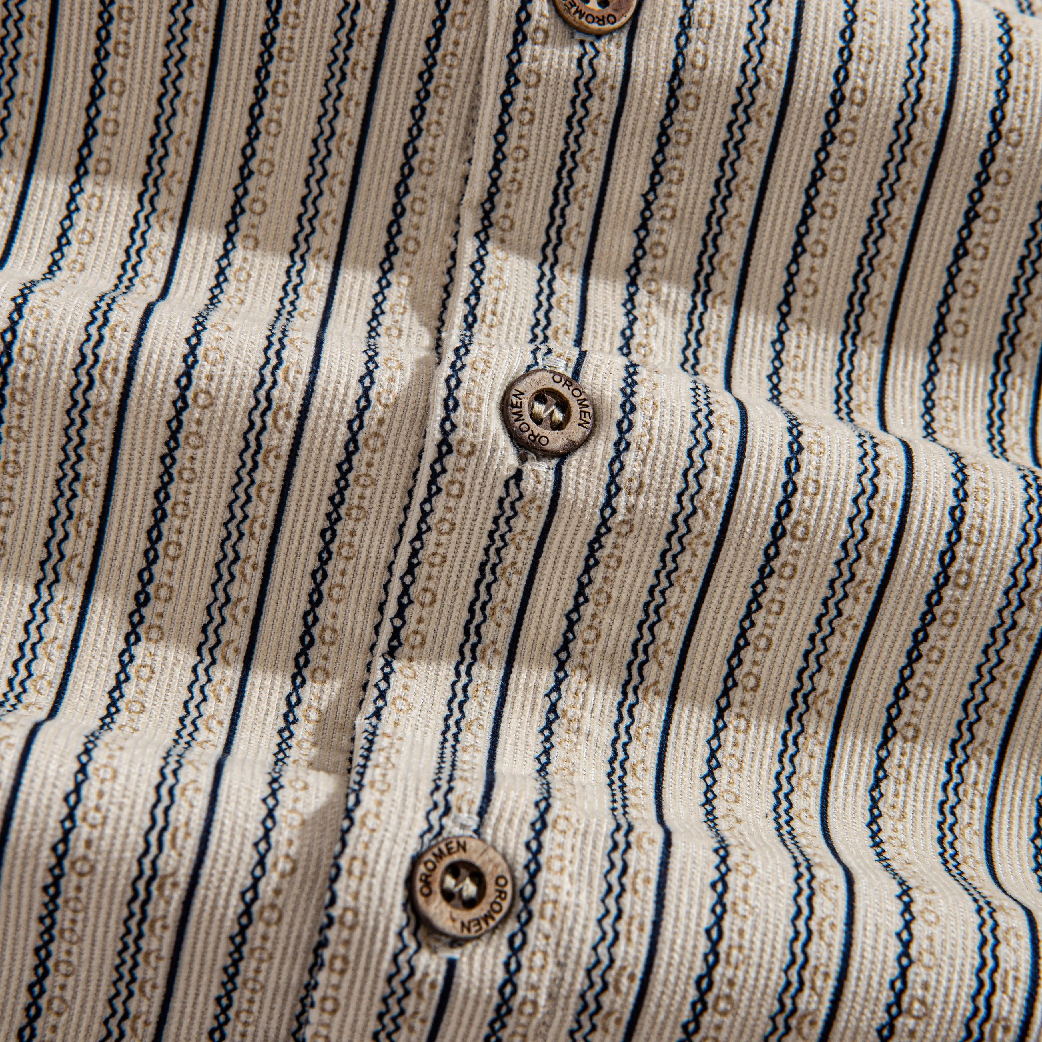 Natural Coconut Buttons Close-Up on OROMEN 100% Cotton Corduroy Shirt – Button-Down Style