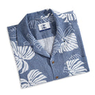 Navy blue linen camp collar shirt with Monstera print - front view on model
