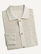 Neatly folded OROMEN Horizontal Textured Ribbed Polo Cardigan highlighting collar and knit texture