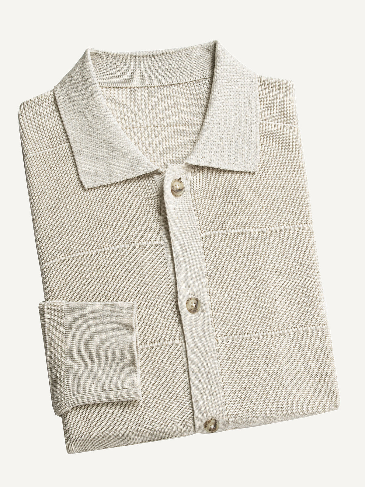 Neatly folded OROMEN Horizontal Textured Ribbed Polo Cardigan highlighting collar and knit texture