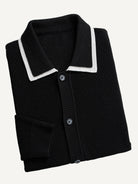 Neatly folded OROMEN Monochrome Contrast Trim Polo Knit Cardigan highlighting white collar trim and ribbed texture