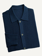 Neatly folded OROMEN indigo ribbed polo collar knit sweater cardigan