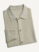 Neatly folded beige Ribbed Button-Down Sweater Cardigan by OROMEN