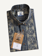 Neatly folded presentation of OROMEN Indigo Batik Shirt