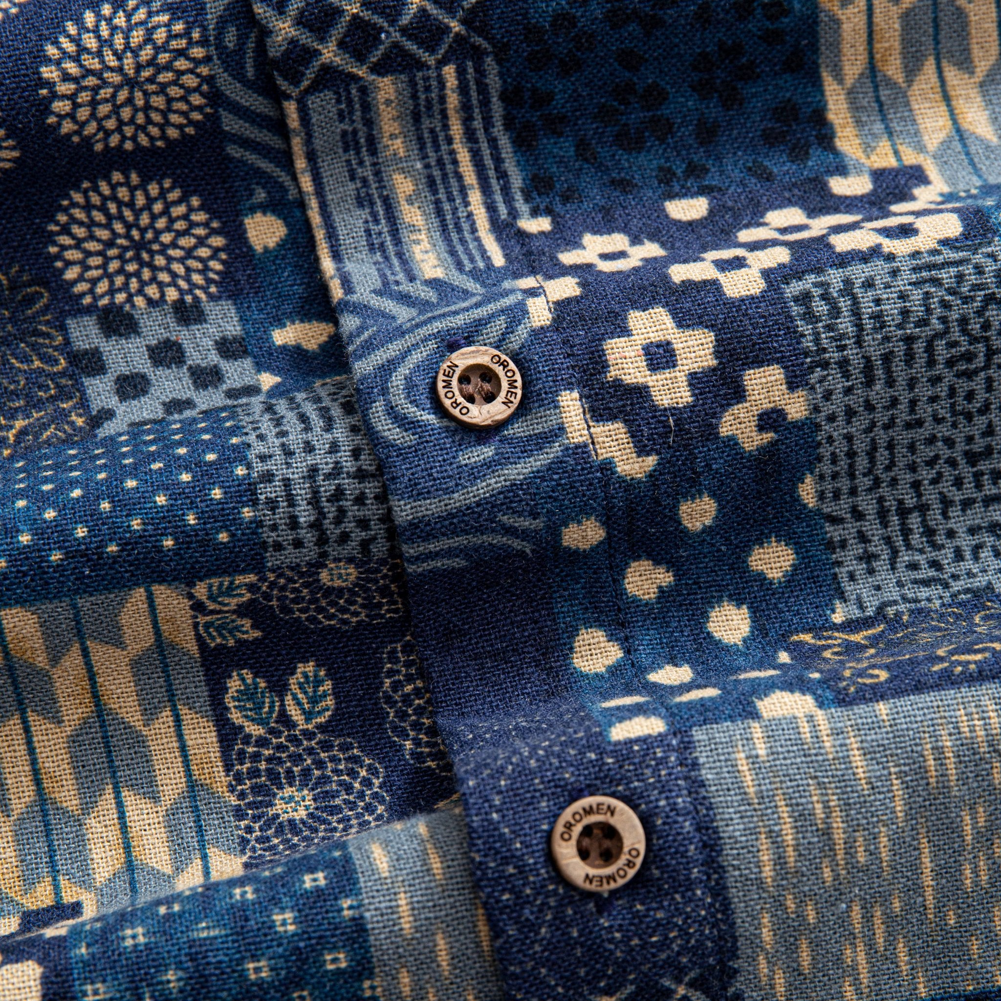 OROMEN Branded Coconut Button Close-up – Indigo Boro Patchwork Shirt