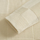 OROMEN Checkerboard Textured Sweater cream sleeve ribbed cuff detail close-up