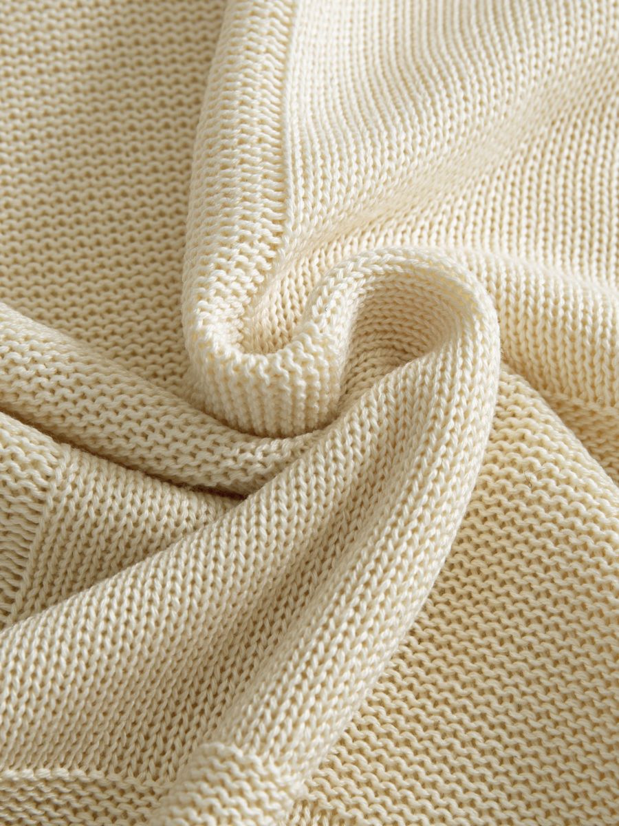 OROMEN Checkerboard Textured Sweater fabric detail highlighting textured checkerboard weave