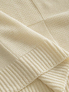 OROMEN Checkerboard Textured Sweater hem detail displaying neat ribbed edge and pattern finish