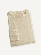 OROMEN Checkerboard Textured Sweater neatly folded flat lay showing rich cream white texture