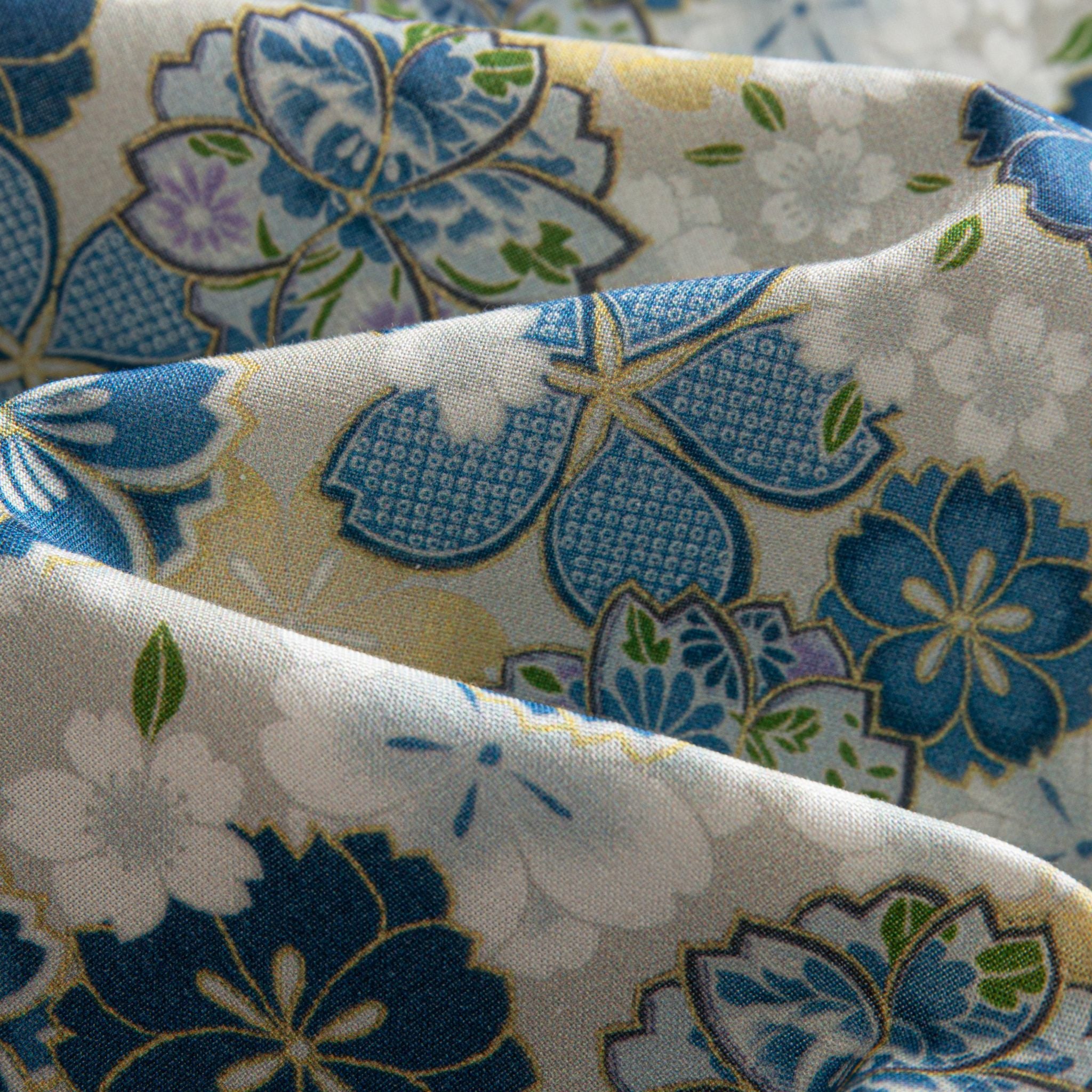 OROMEN Cherry Blossoms in Full Bloom shirt fabric close-up navy and sky blue sakura on cream cotton