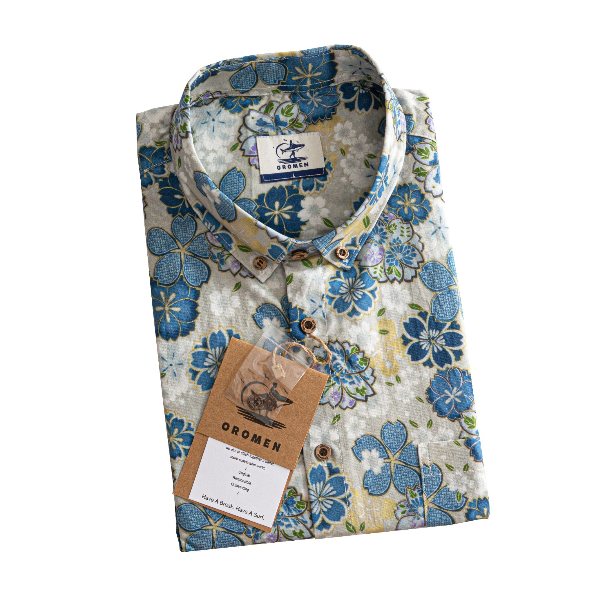 OROMEN Cherry Blossoms in Full Bloom shirt folded with branded tag and coconut buttons