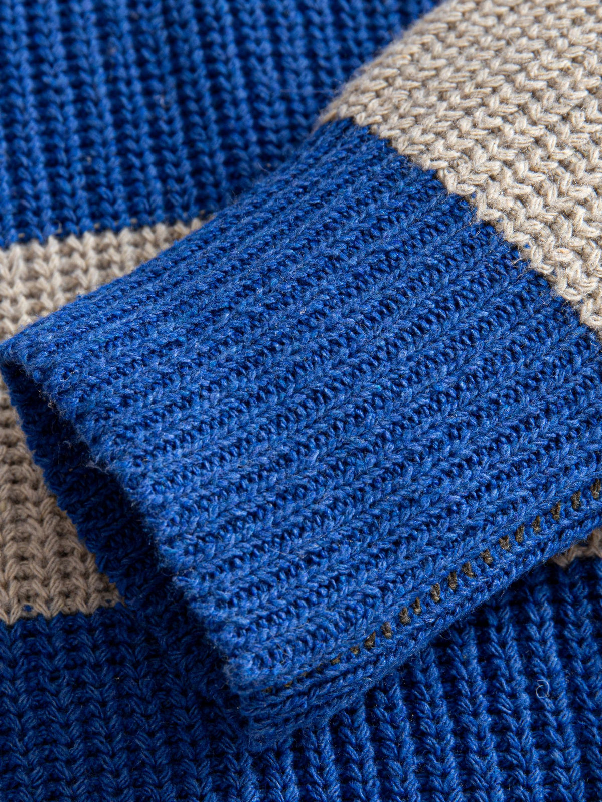 OROMEN Color-Block Striped V-Neck Sweater sleeve cuff detail showing structured ribbed blue trim