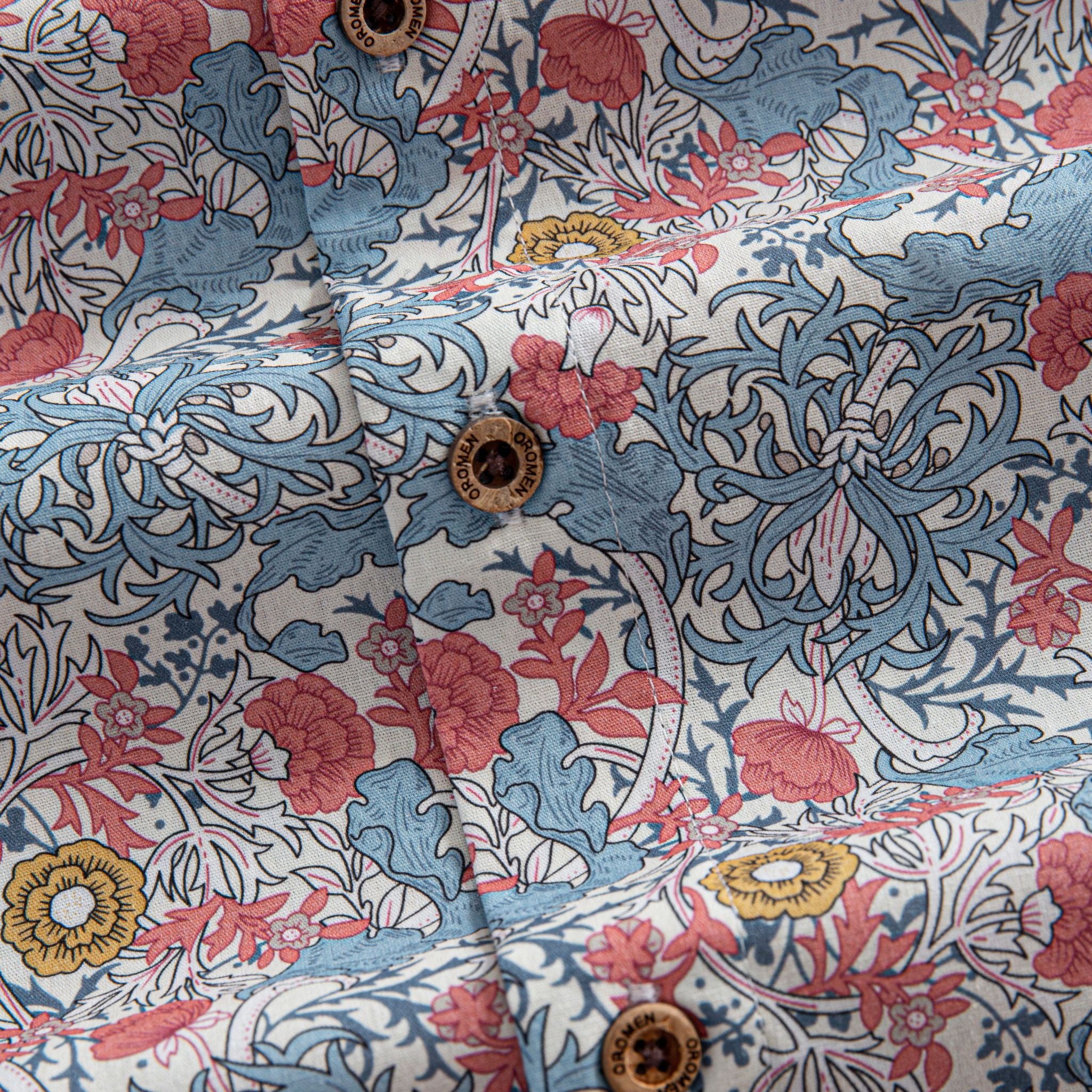 OROMEN Floral Garden Hawaiian Shirt – Branded Coconut Button Close-Up, Floral Cotton Fabric