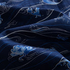 OROMEN Hokusai Kairin shirt fabric close-up, white wave lines and blue cloud motifs on deep navy cotton