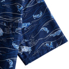 OROMEN Hokusai Kairin shirt sleeve detail, white wave lines and blue cresting surf on navy cotton