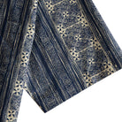 OROMEN Indigo Batik shirt sleeve detail, geometric Batik stripe in navy and off-white cotton
