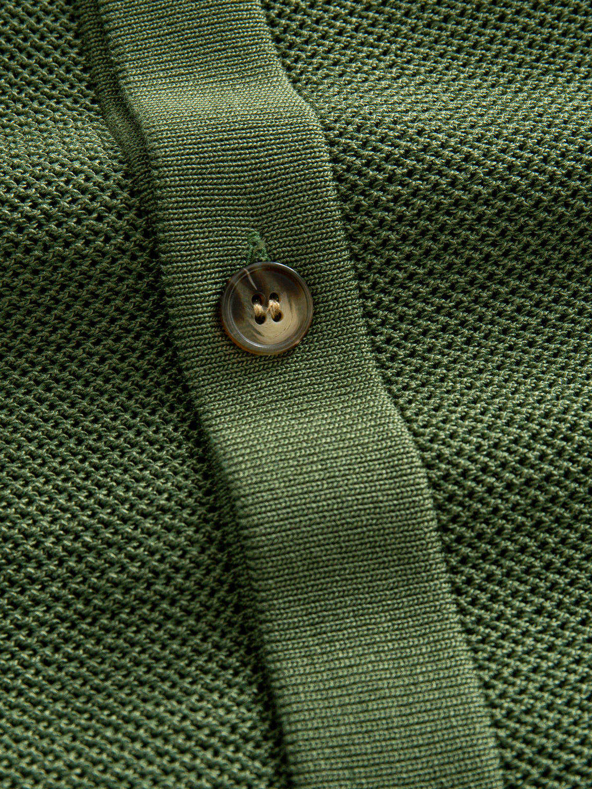 OROMEN Marcel Striped Knit Polo button placket detail featuring authentic shell-textured buttons