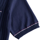 OROMEN Navy Ribbed Knit Polo Shirt — Short Sleeve Cuff Close-Up with Red and White Contrast Tipping on Ribbed Hem