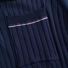 OROMEN Navy Ribbed Knit Polo Shirt — Welt Chest Pocket Close-Up with Red and White Contrast Tipping and Wide Rib Knit Texture