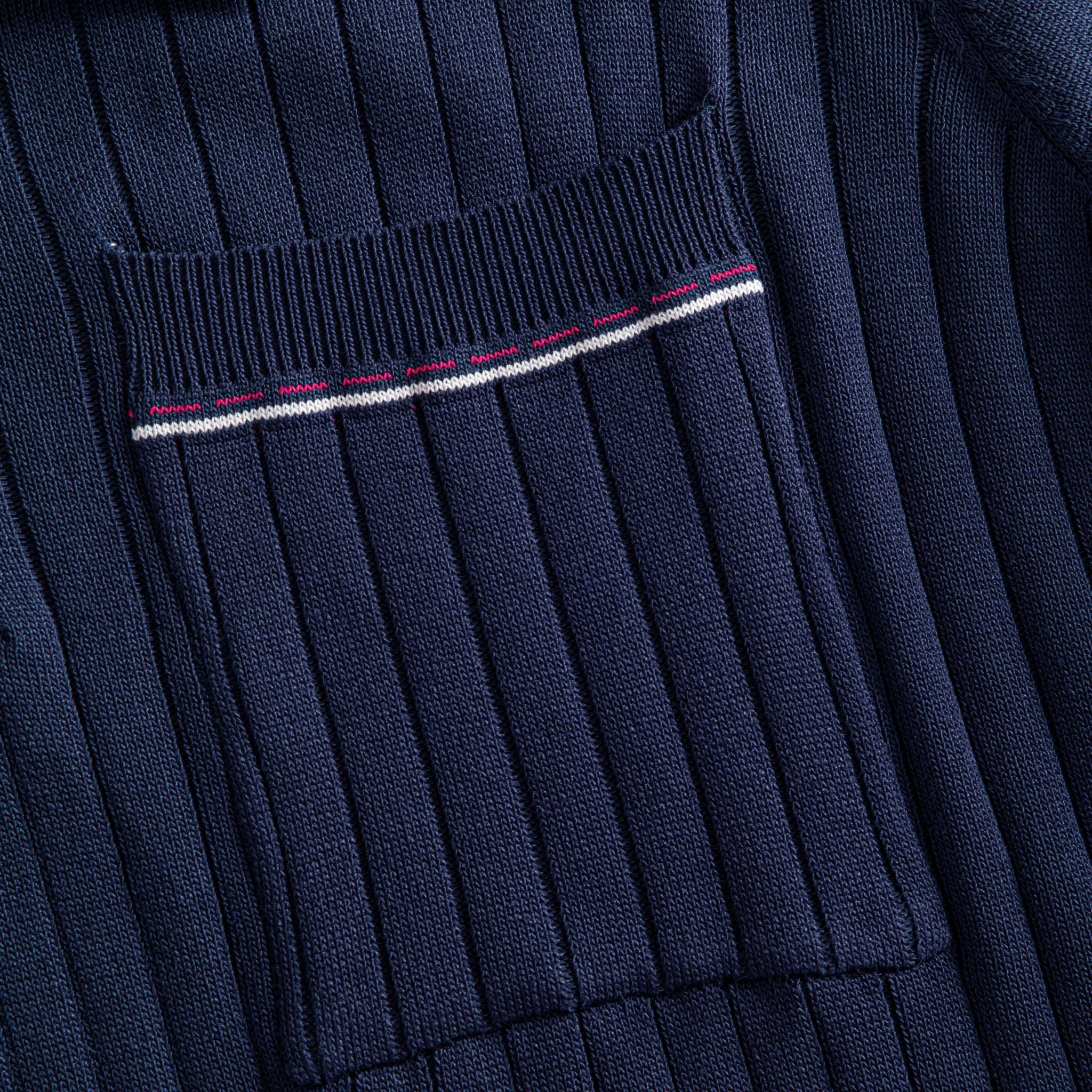OROMEN Navy Ribbed Knit Polo Shirt — Welt Chest Pocket Close-Up with Red and White Contrast Tipping and Wide Rib Knit Texture