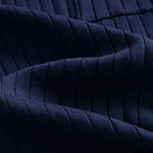 OROMEN Navy Wide-Rib Knit Polo Shirt — Close-Up Fabric Texture Showing Wide Vertical Rib Knit Structure and Contrast Tipping Edge