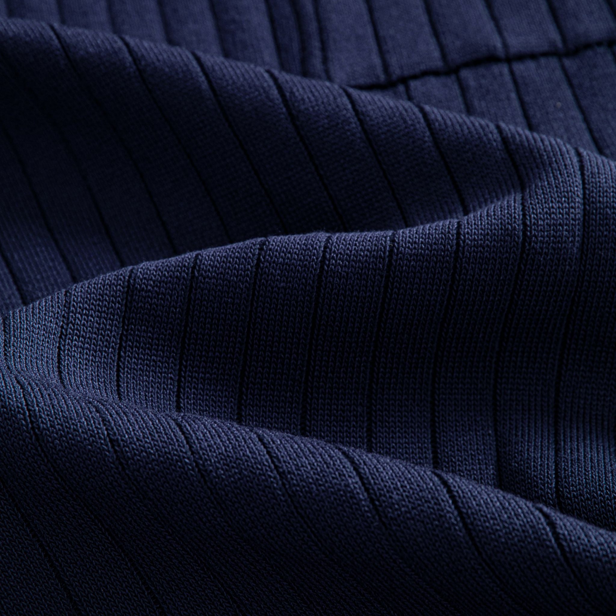 OROMEN Navy Wide-Rib Knit Polo Shirt — Close-Up Fabric Texture Showing Wide Vertical Rib Knit Structure and Contrast Tipping Edge