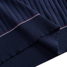 OROMEN Navy Wide-Rib Knit Polo Shirt — Hem Detail Showing Red and White Contrast Tipping and Ribbed Knit Fabric Texture