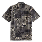 OROMEN Noir Patchwork Hawaiian shirt back flat lay showing full allover monochrome patchwork block layout with florals, roses, polka dots, snowflake geometrics and lace medallions in black and off-white