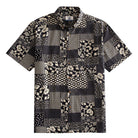 OROMEN Noir Patchwork Hawaiian shirt front flat lay showing full allover monochrome patchwork block layout with florals, roses, polka dots, geometrics and lace medallions in black and off-white
