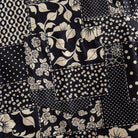 OROMEN Noir Patchwork shirt chest pocket close-up showing large floral, rose, daisy and polka dot patchwork print continuing across pocket seam in black and off-white