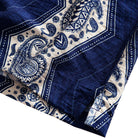 OROMEN Paisley Bandana shirt side vent detail showing hem opening with navy blue and off-white paisley print and geometric border