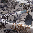 OROMEN Reef Atlas Hawaiian shirt – folded fabric detail showing lobster, tropical fish and coral naturalist print on white cotton