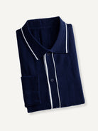 OROMEN Ribbed Contrast Knit Polo neatly folded flat lay displaying contrast collar and navy knit