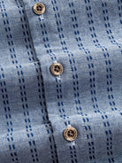 OROMEN Sashiko Chambray Cotton Shirt button placket detail featuring natural coconut buttons