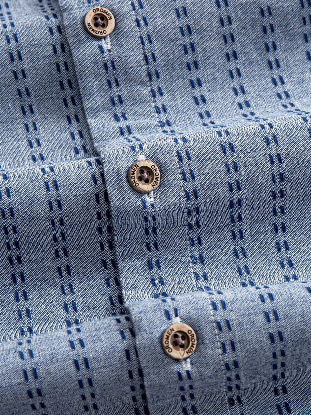 OROMEN Sashiko Chambray Cotton Shirt button placket detail featuring natural coconut buttons