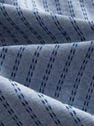 OROMEN Sashiko Chambray Cotton Shirt fabric detail highlighting navy sashiko stitching on chambray