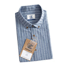 OROMEN Sashiko Chambray shirt folded with branded tag and coconut buttons detail