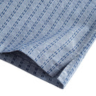 OROMEN Sashiko Chambray shirt side vent and hem detail, navy Sashiko stitch with double needle stitching